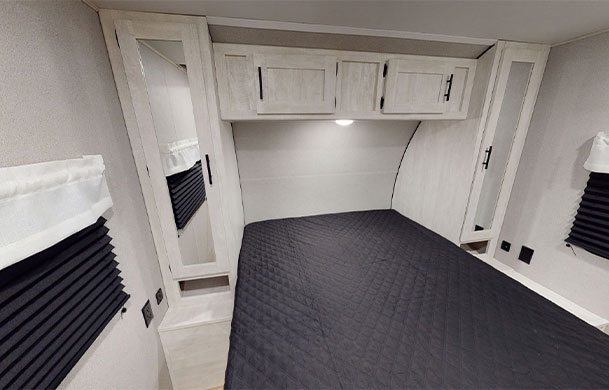 Premium RV rental queen bedroom at Adventure Bound Southwoods